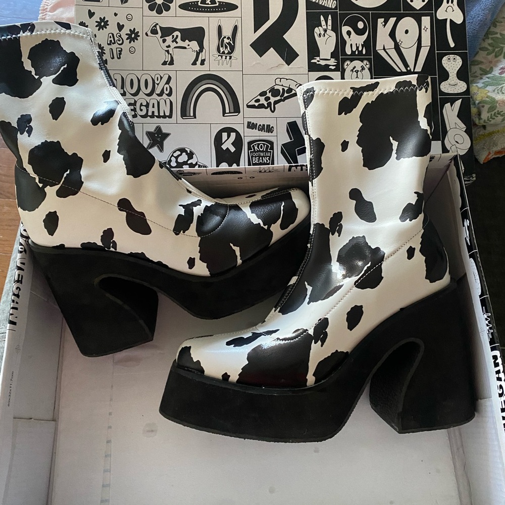 Cow print platform boots